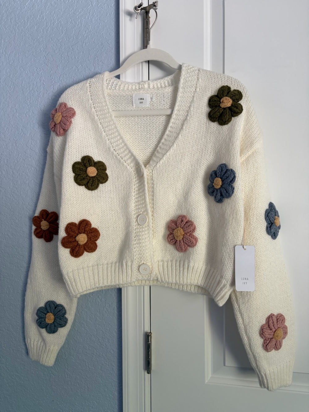 Anthropologie’s Luna + Ivy Cream Cropped Cardigan with 3D Flowers